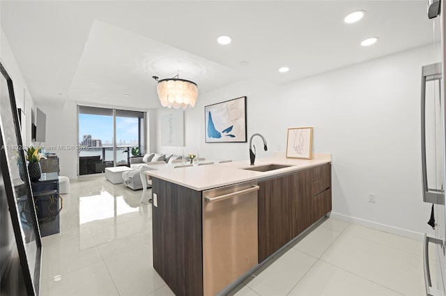 488 NE 18th St Unit 704, Miami, FL 33132 - kitchen with a sink, modern cabinets, stainless steel dishwasher, light countertops, and light tile patterned floors