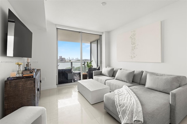 488 NE 18th St Unit 704, Miami, FL 33132 - living area featuring light tile patterned floors, expansive windows, baseboards, and a city view