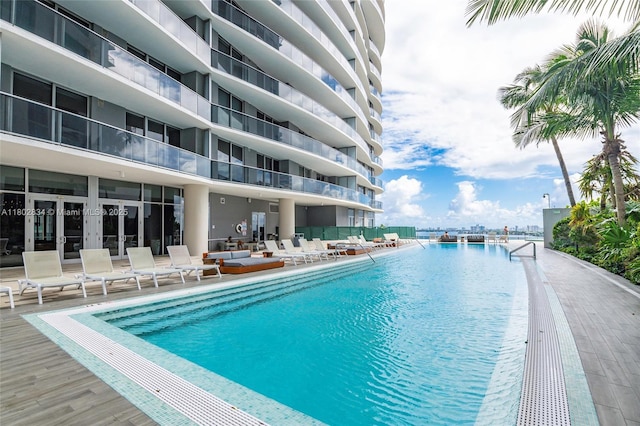 488 NE 18th St Unit 704, Miami, FL 33132 - community pool with french doors, an outdoor hangout area, and a patio area