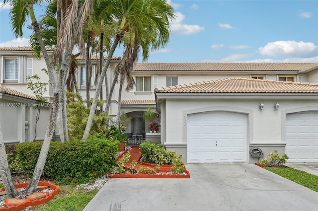 7377 SW 162nd Path, Miami, FL 33193 - view of front of home featuring concrete driveway, stucco siding, a tiled roof, and an attached garage