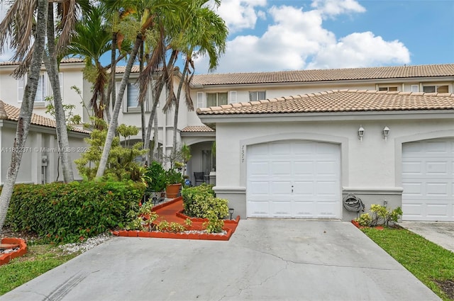 7377 SW 162nd Path, Miami, FL 33193 - mediterranean / spanish house featuring driveway, a tiled roof, and stucco siding