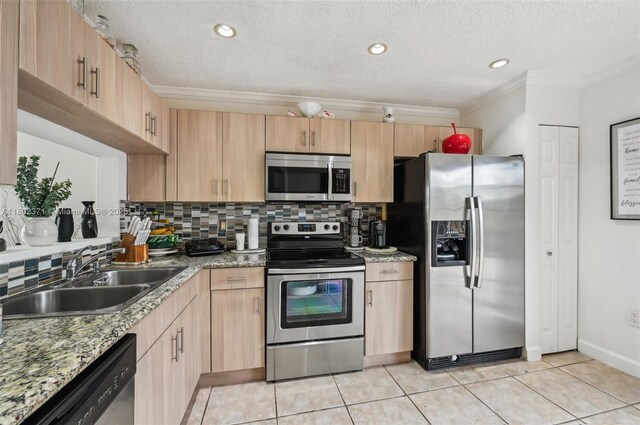 7377 SW 162nd Path, Miami, FL 33193 - kitchen featuring appliances with stainless steel finishes, a sink, decorative backsplash, light brown cabinets, and a textured ceiling