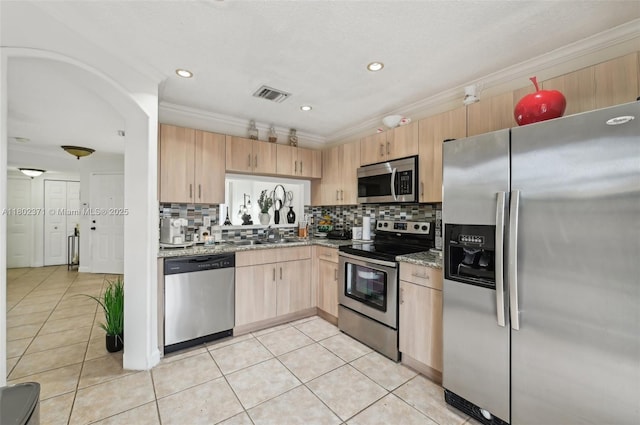 7377 SW 162nd Path, Miami, FL 33193 - kitchen with stainless steel appliances, light brown cabinets, light stone countertops, decorative backsplash, and ornamental molding