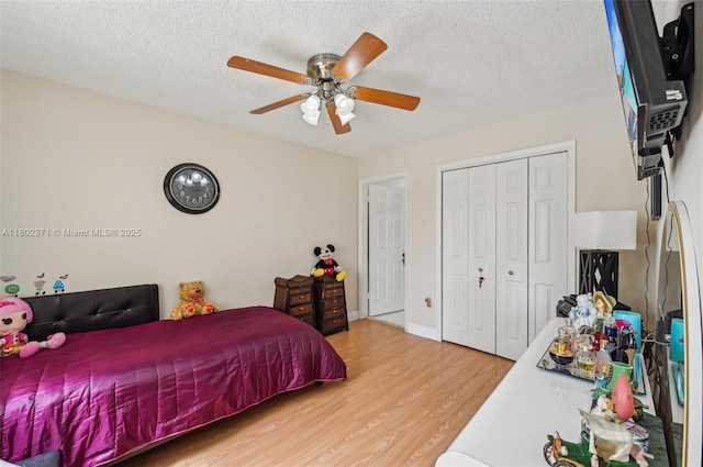7377 SW 162nd Path, Miami, FL 33193 - bedroom featuring light wood-style flooring, a closet, ceiling fan, and a textured ceiling
