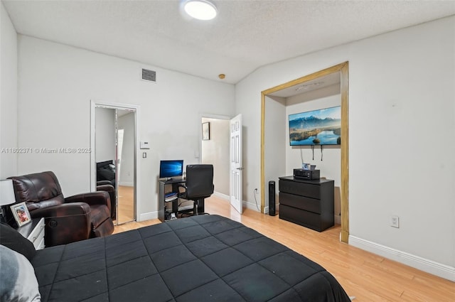 7377 SW 162nd Path, Miami, FL 33193 - bedroom with light wood-style floors, baseboards, a desk, and vaulted ceiling