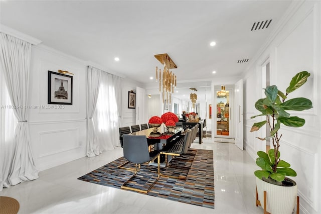726 NE 17th Way, Fort Lauderdale, FL 33304 - dining room with a decorative wall, crown molding, and recessed lighting