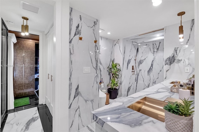 726 NE 17th Way, Fort Lauderdale, FL 33304 - bathroom with marble tiled floors, stone wall, a marble finish shower, toilet, and recessed lighting
