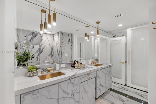 726 NE 17th Way, Fort Lauderdale, FL 33304 - bathroom with a marble finish shower, double vanity, recessed lighting, and marble finish flooring