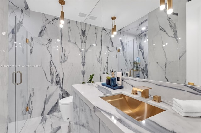 726 NE 17th Way, Fort Lauderdale, FL 33304 - full bath featuring a marble finish shower, toilet, vanity, and tile walls