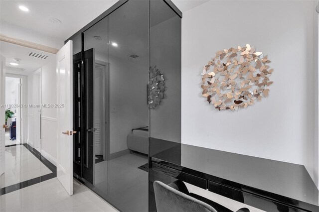 726 NE 17th Way, Fort Lauderdale, FL 33304 - corridor with light tile patterned flooring