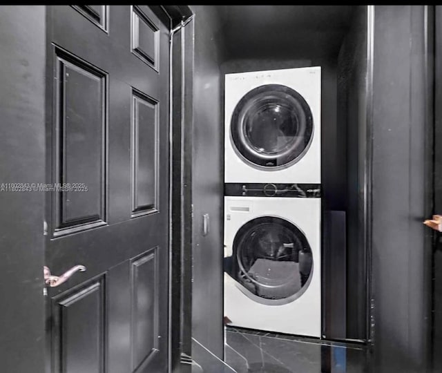 726 NE 17th Way, Fort Lauderdale, FL 33304 - washroom with stacked washer / dryer