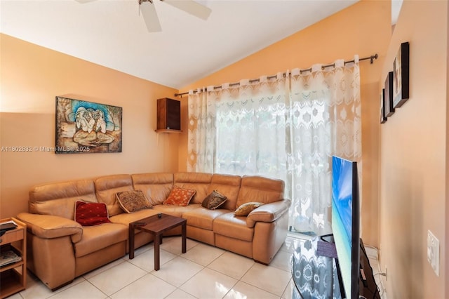 tiled living area featuring lofted ceiling and a ceiling fan