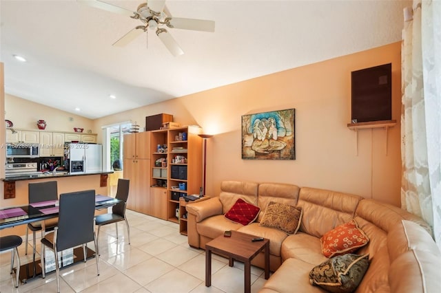 living area with vaulted ceiling, ceiling fan, light tile patterned floors, and recessed lighting