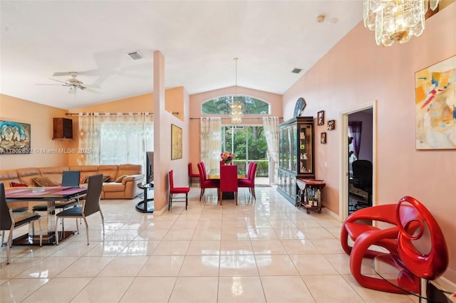 tiled dining space featuring a chandelier, lofted ceiling, baseboards, and a ceiling fan