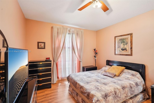 bedroom with wood finished floors and a ceiling fan