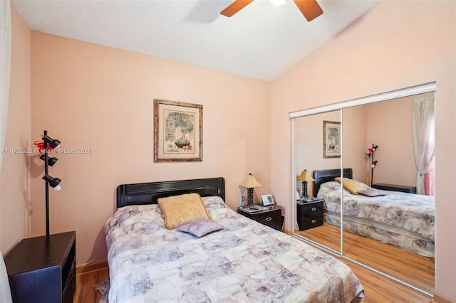 bedroom featuring vaulted ceiling, wood finished floors, a closet, and ceiling fan