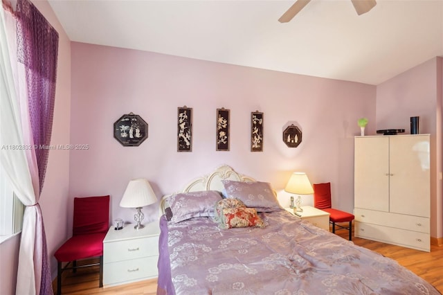 bedroom featuring wood finished floors and ceiling fan