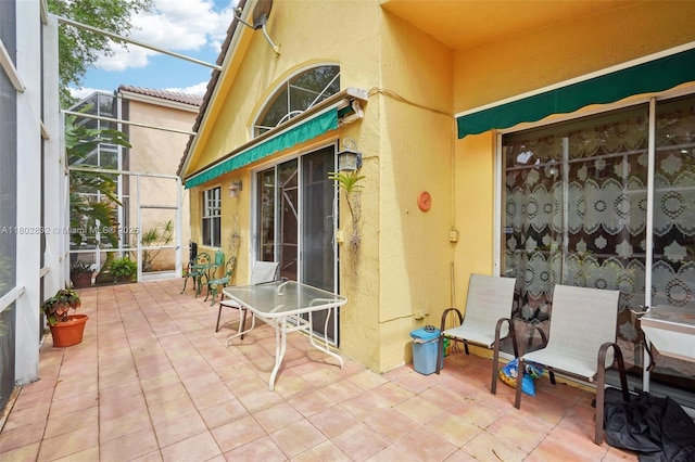 view of patio / terrace with a lanai