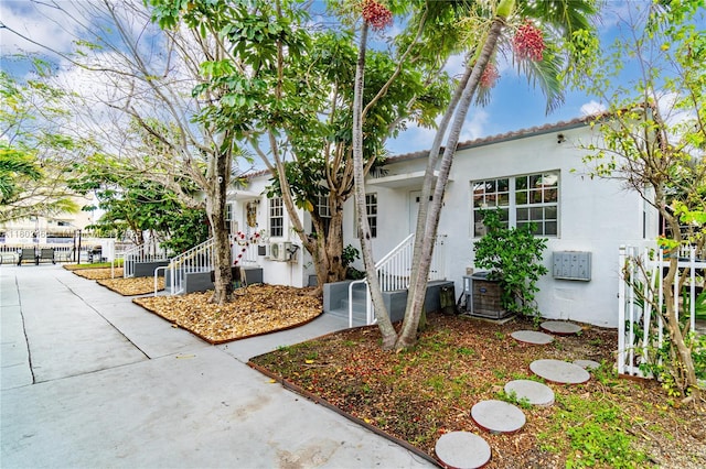 8335 E Crespi Blvd Unit 4, Miami Beach, FL 33141 - view of property exterior with stucco siding and fence
