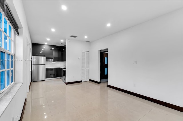 8335 E Crespi Blvd Unit 4, Miami Beach, FL 33141 - kitchen with appliances with stainless steel finishes, dark cabinets, modern cabinets, light countertops, and recessed lighting
