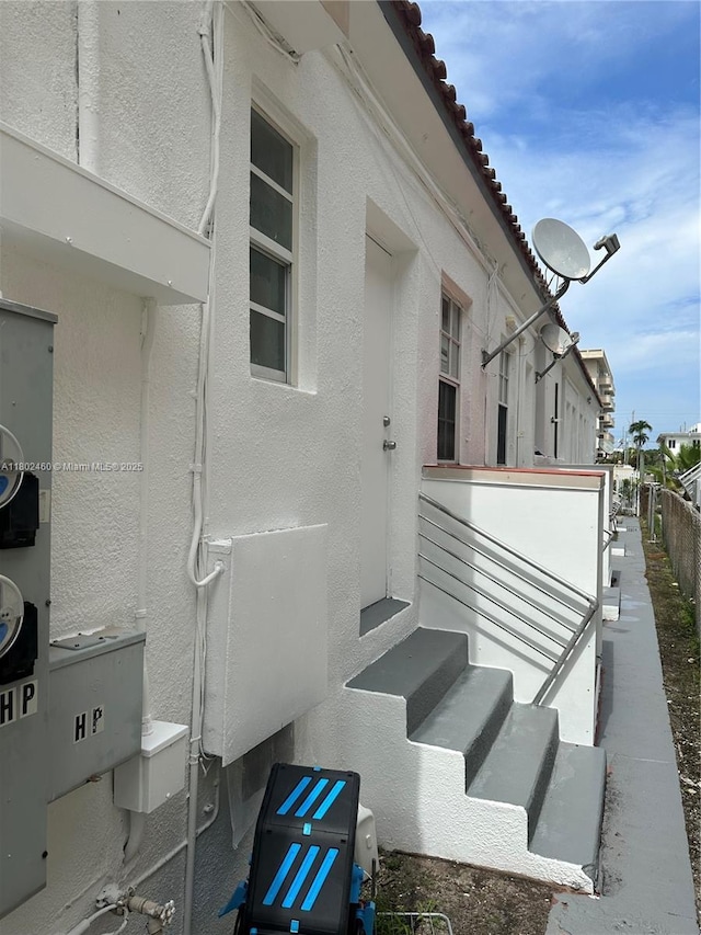 8335 E Crespi Blvd Unit 4, Miami Beach, FL 33141 - view of property exterior featuring stucco siding and entry steps