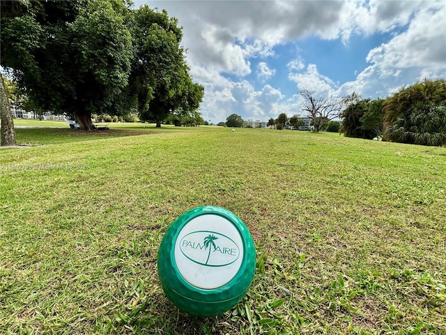 3051 S Palm Aire Dr Unit 203, Pompano Beach, FL 33069 - surrounding community featuring a lawn