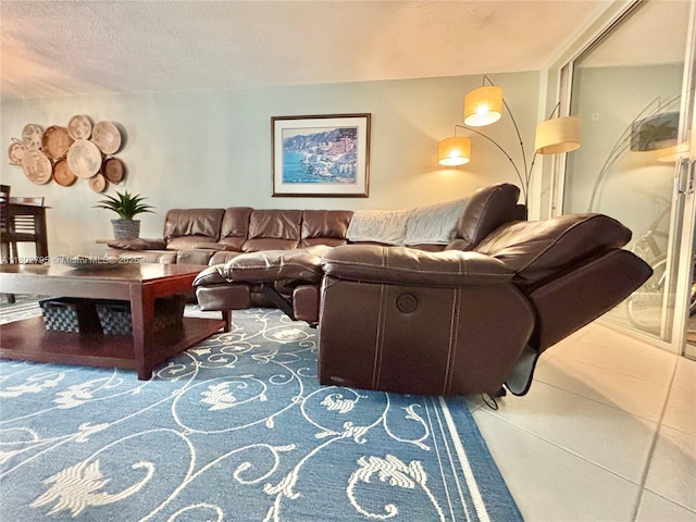 3051 S Palm Aire Dr Unit 203, Pompano Beach, FL 33069 - living room featuring tile patterned flooring and a textured ceiling