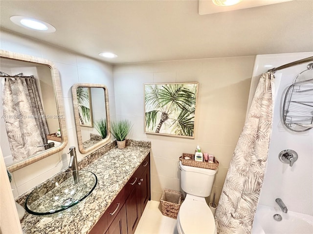 3051 S Palm Aire Dr Unit 203, Pompano Beach, FL 33069 - full bathroom featuring tile walls, vanity, toilet, and shower / bath combo with shower curtain