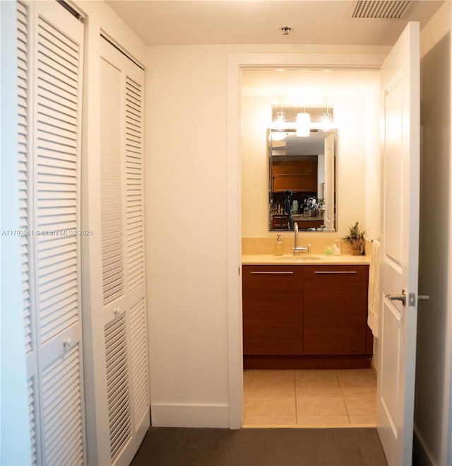 2681 N Flamingo Rd Unit 1206S, Sunrise, FL 33323 - bathroom featuring vanity, a closet, tile patterned flooring, and baseboards