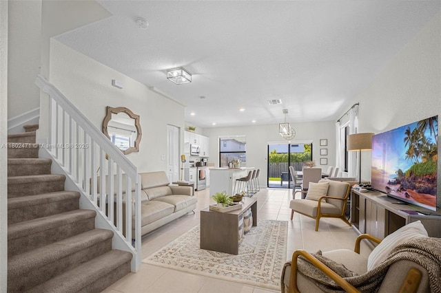 25280 SW 108th Ct, Homestead, FL 33032 - living room featuring light tile patterned flooring, stairway, and recessed lighting