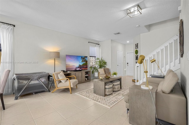 25280 SW 108th Ct, Homestead, FL 33032 - living area with light tile patterned floors, stairway, a textured ceiling, and recessed lighting