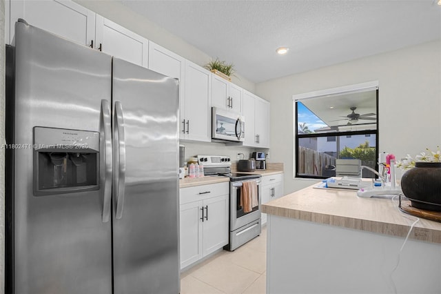 25280 SW 108th Ct, Homestead, FL 33032 - kitchen with stainless steel appliances, a sink, white cabinetry, light countertops, and recessed lighting