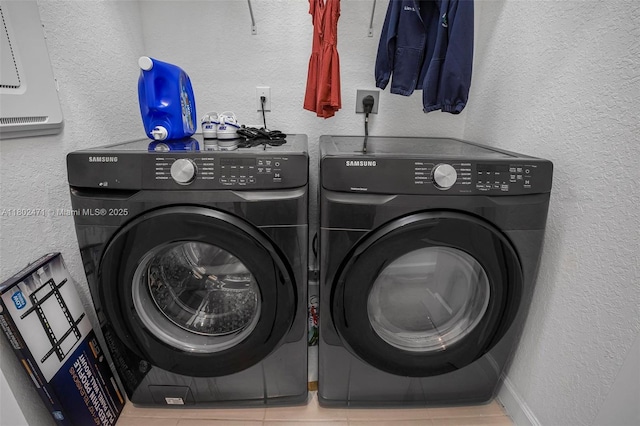 25280 SW 108th Ct, Homestead, FL 33032 - laundry room with independent washer and dryer, a textured wall, and tile patterned flooring