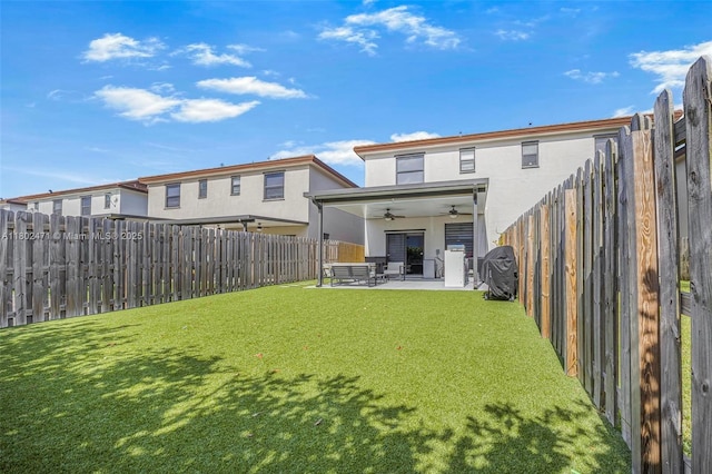 25280 SW 108th Ct, Homestead, FL 33032 - back of property featuring ceiling fan, stucco siding, a patio, and an outdoor living space