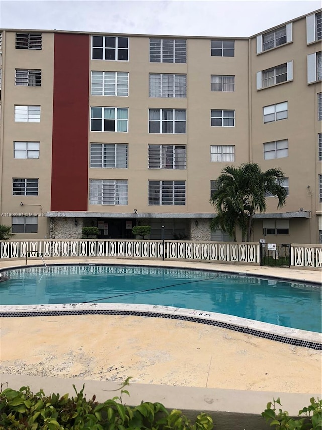 1475 NE 125th Ter Unit 301A, North Miami, FL 33161 - community pool featuring fence