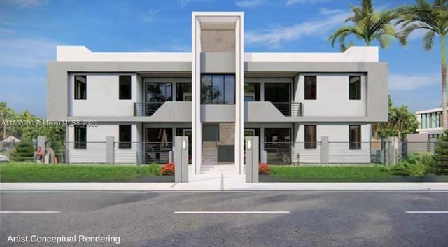 3446 NW 1st Ave, Miami, FL 33127 - view of front of house with fence, stucco siding, and uncovered parking
