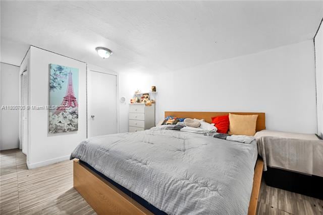 3446 NW 1st Ave, Miami, FL 33127 - bedroom featuring wood finished floors and baseboards
