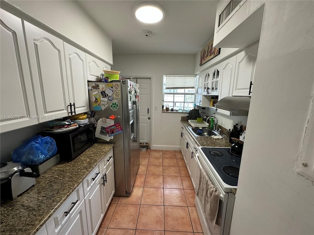 9260 Bay Harbor Ter Unit 24, Bay Harbor Islands, FL 33154 - kitchen with a sink, stainless steel fridge, white range with electric cooktop, and white cabinetry
