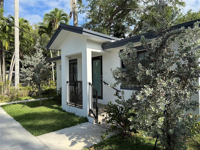 210 SW 3rd St, Florida City, FL 33034 - property entrance with stucco siding