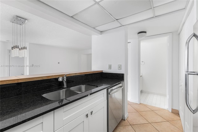 540 Brickell Key Dr Unit 904, Miami, FL 33131 - kitchen with a sink, dishwasher, light tile patterned flooring, white cabinets, and dark stone countertops