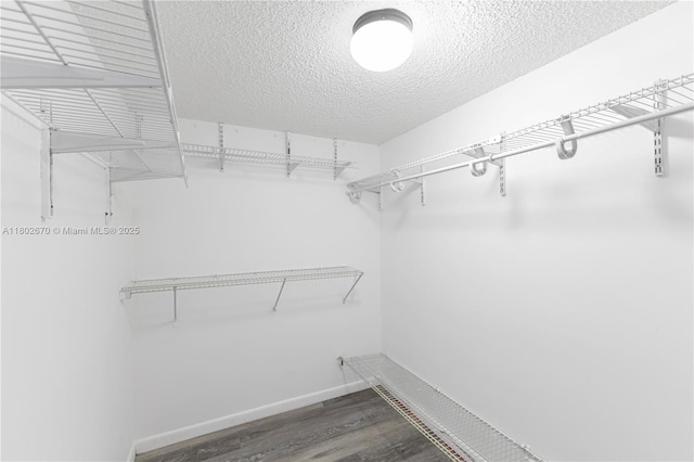 540 Brickell Key Dr Unit 904, Miami, FL 33131 - walk in closet featuring wood finished floors
