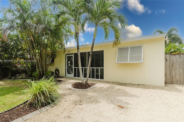 1112 N 31st Ave, Hollywood, FL 33021 - back of house with stucco siding, fence, and a patio