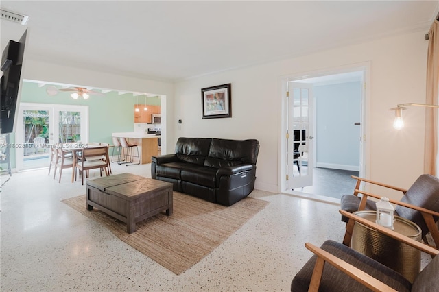 1112 N 31st Ave, Hollywood, FL 33021 - living room with speckle patterned floor and ceiling fan