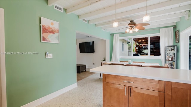 1112 N 31st Ave, Hollywood, FL 33021 - kitchen with baseboards, a ceiling fan, beam ceiling, dark speckled floor, and light countertops