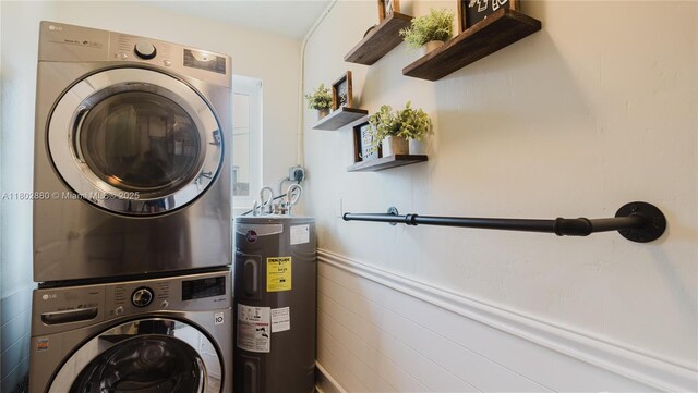 1112 N 31st Ave, Hollywood, FL 33021 - clothes washing area with water heater and stacked washer / dryer