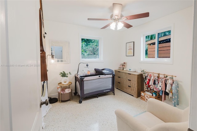 1112 N 31st Ave, Hollywood, FL 33021 - sitting room with healthy amount of natural light, a ceiling fan, baseboards, and speckled floor
