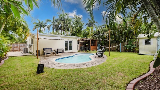1112 N 31st Ave, Hollywood, FL 33021 - view of swimming pool featuring a patio and central AC