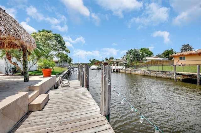 6001 SW 18th St, Plantation, FL 33317 - dock with a water view and fence