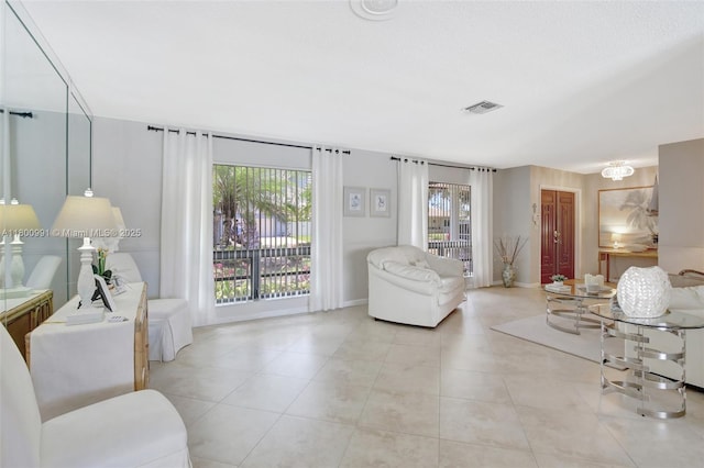 6001 SW 18th St, Plantation, FL 33317 - living area with light tile patterned floors and baseboards