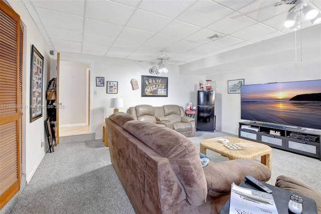 6001 SW 18th St, Plantation, FL 33317 - carpeted living area with ceiling fan, a paneled ceiling, and baseboards